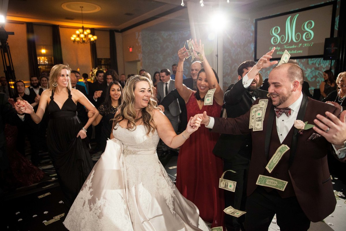 A bride and groom dance at their ceremony.