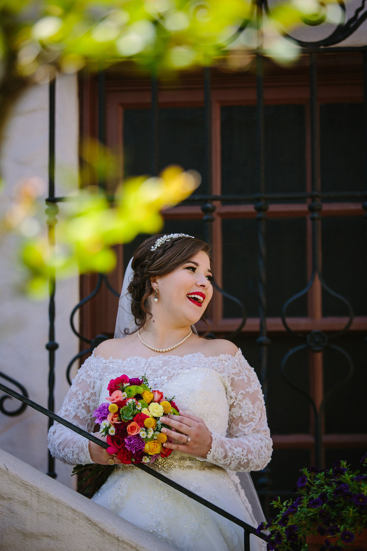 bride smiling on the stairs at the McNay Art Museum in San Antonio