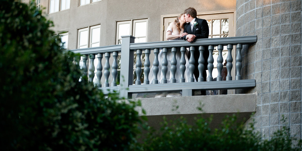 Austin wedding photographer castle avalon wedding photographer bride groom back balcony
