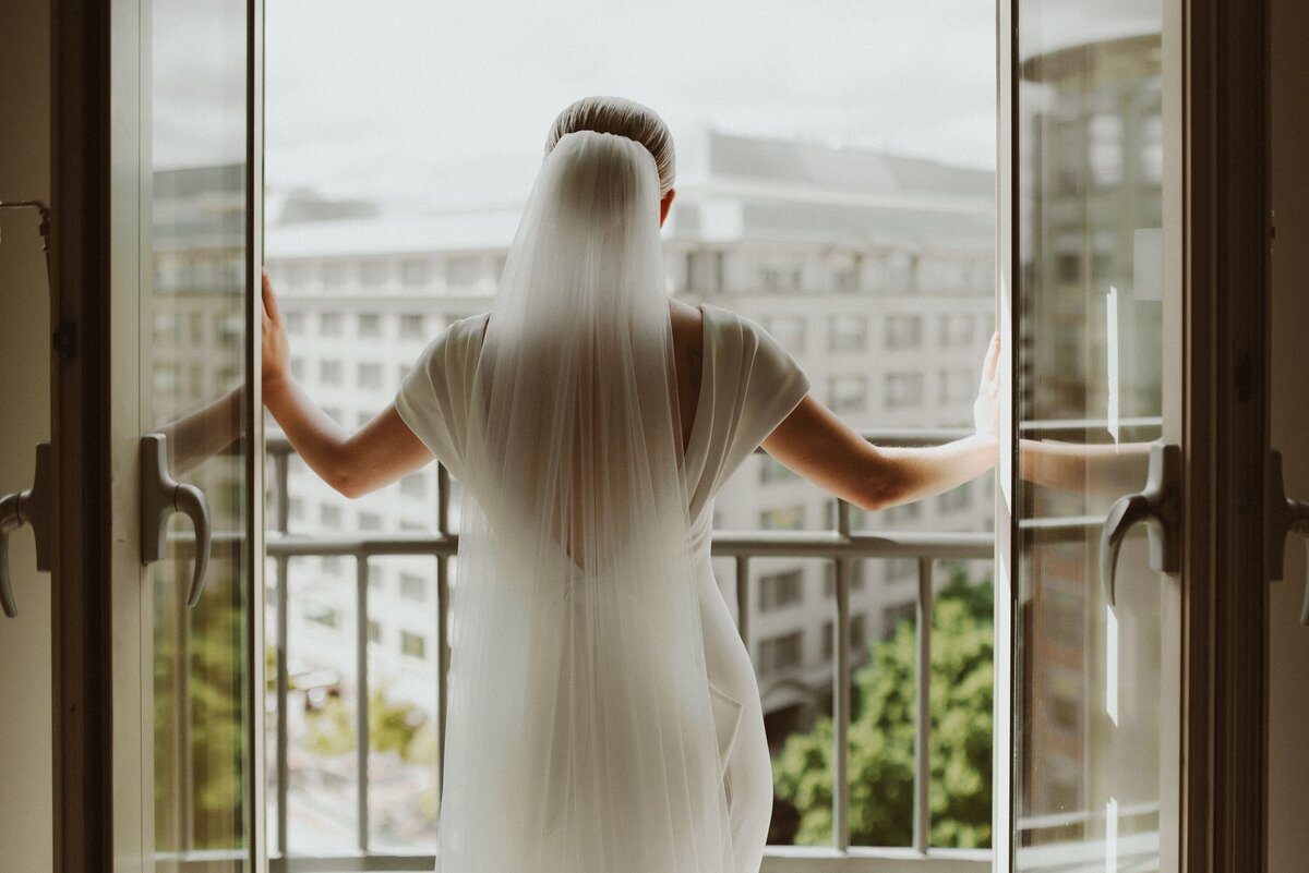 Event-Planning-DC-Wedding-Westin-Georgetown-Hotel-jewelsy-photography-bride-veil-back-looking-window