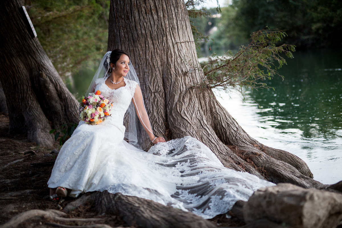 Bride sitting by tree for San Antonio Wedding Photographer at Milltown Historic District Wedding Venue by Expose the Heart