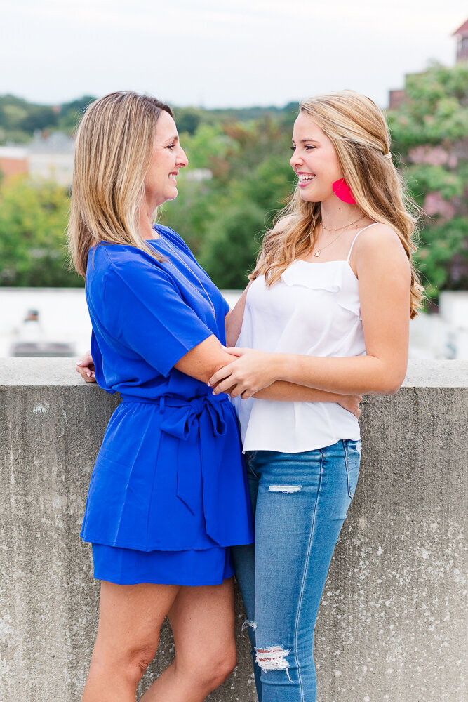 Candid moment of mother and daughter  on Raleigh rooftop.