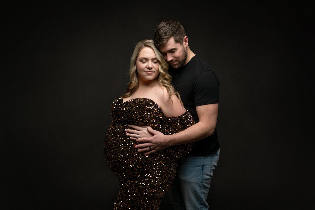 Studio maternity session with couple.