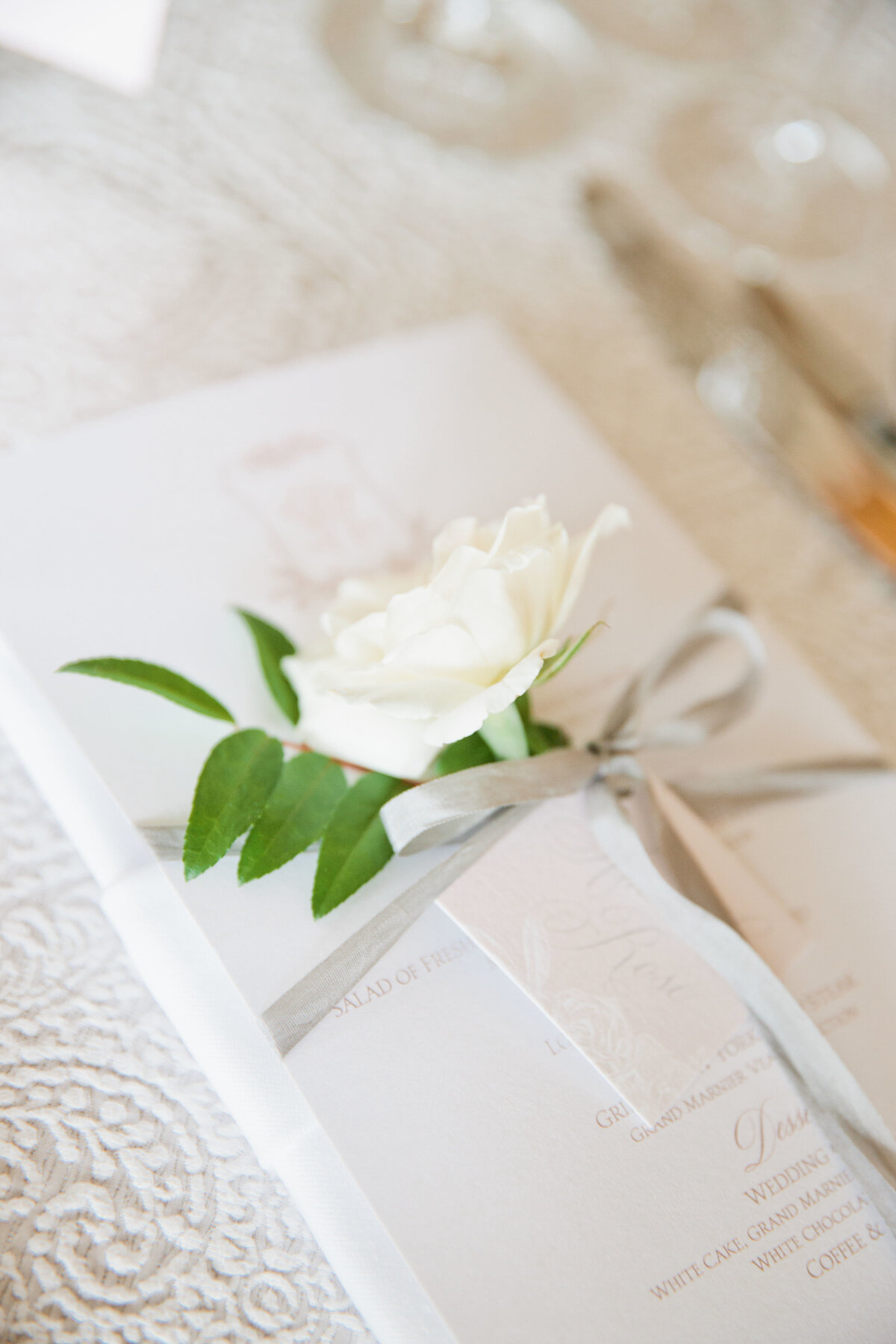 Menu cards with hand tags and floral sprigs
