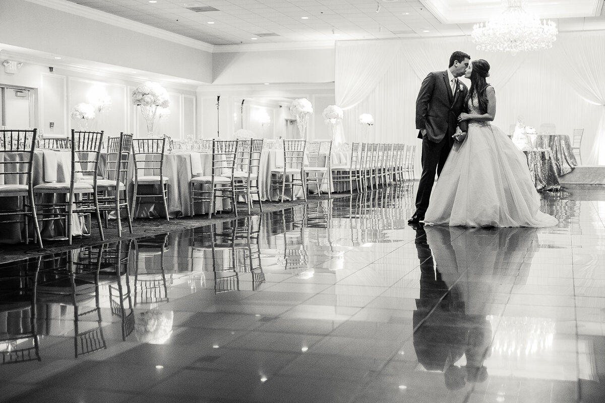 njeri-bishota-lauren-ashley-bride-groom-tile-floor-reflections-wedding-reception-black-and-white