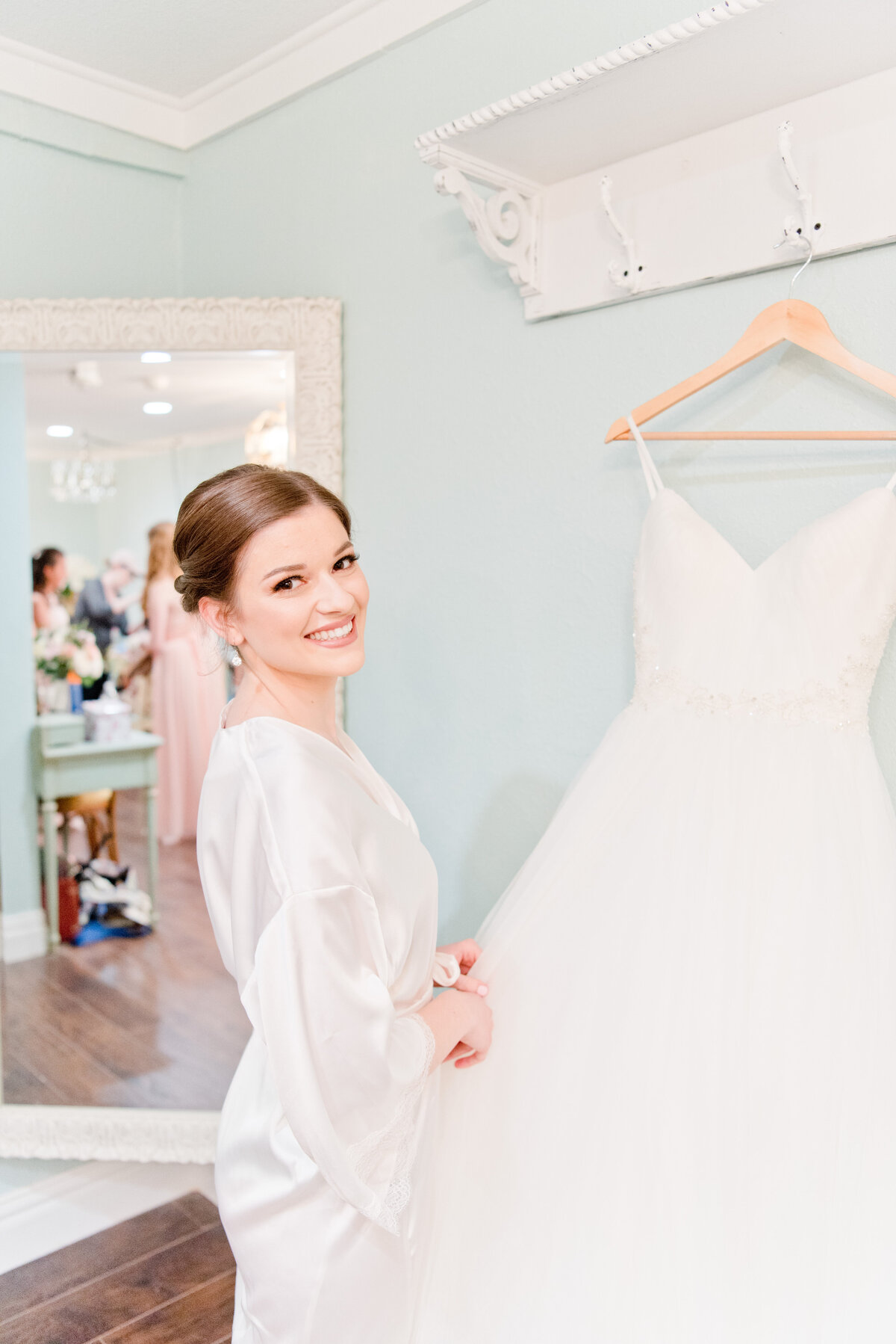 Bride admires wedding dress in Fort Worth Texas