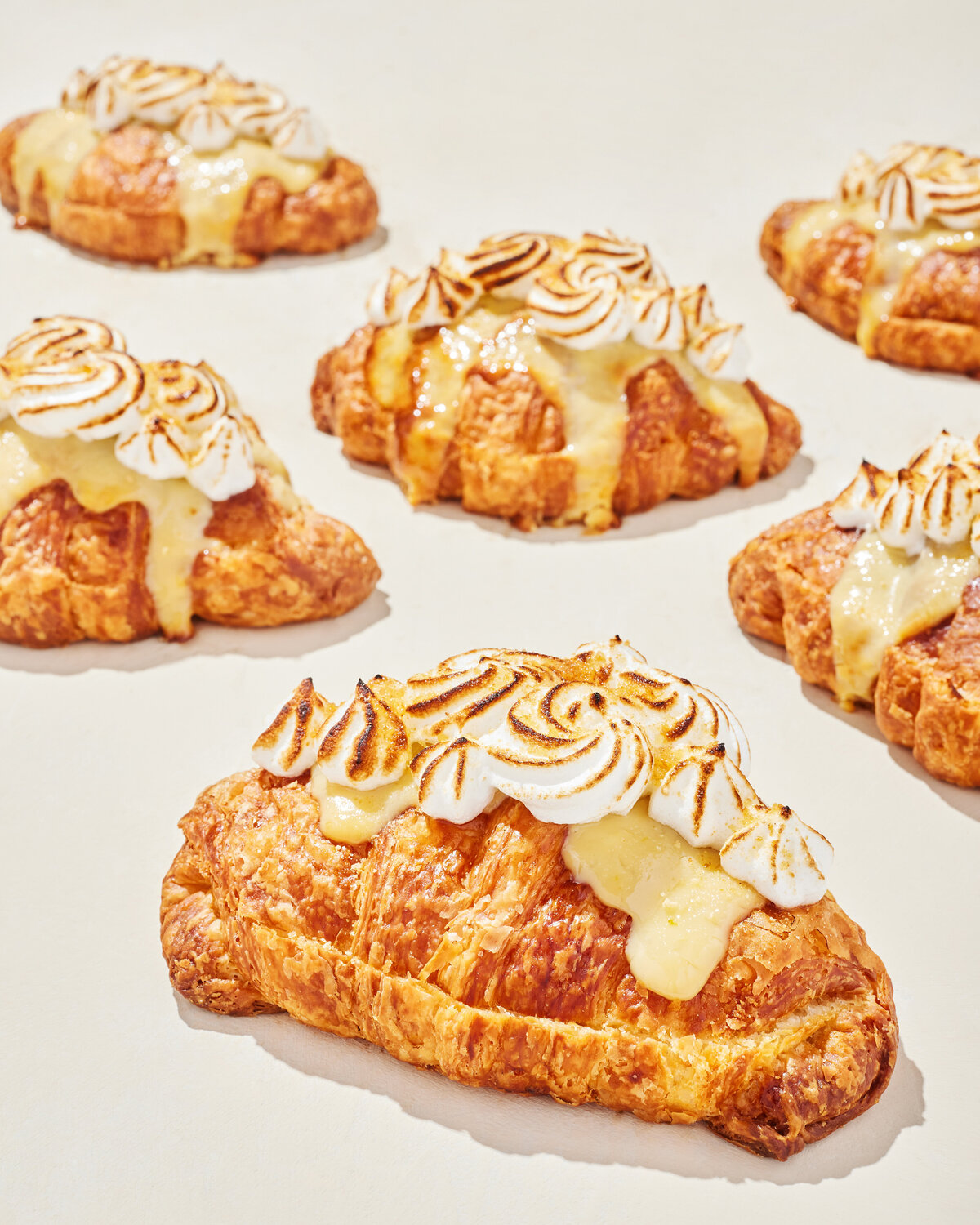 Croissants topped with whipped cream