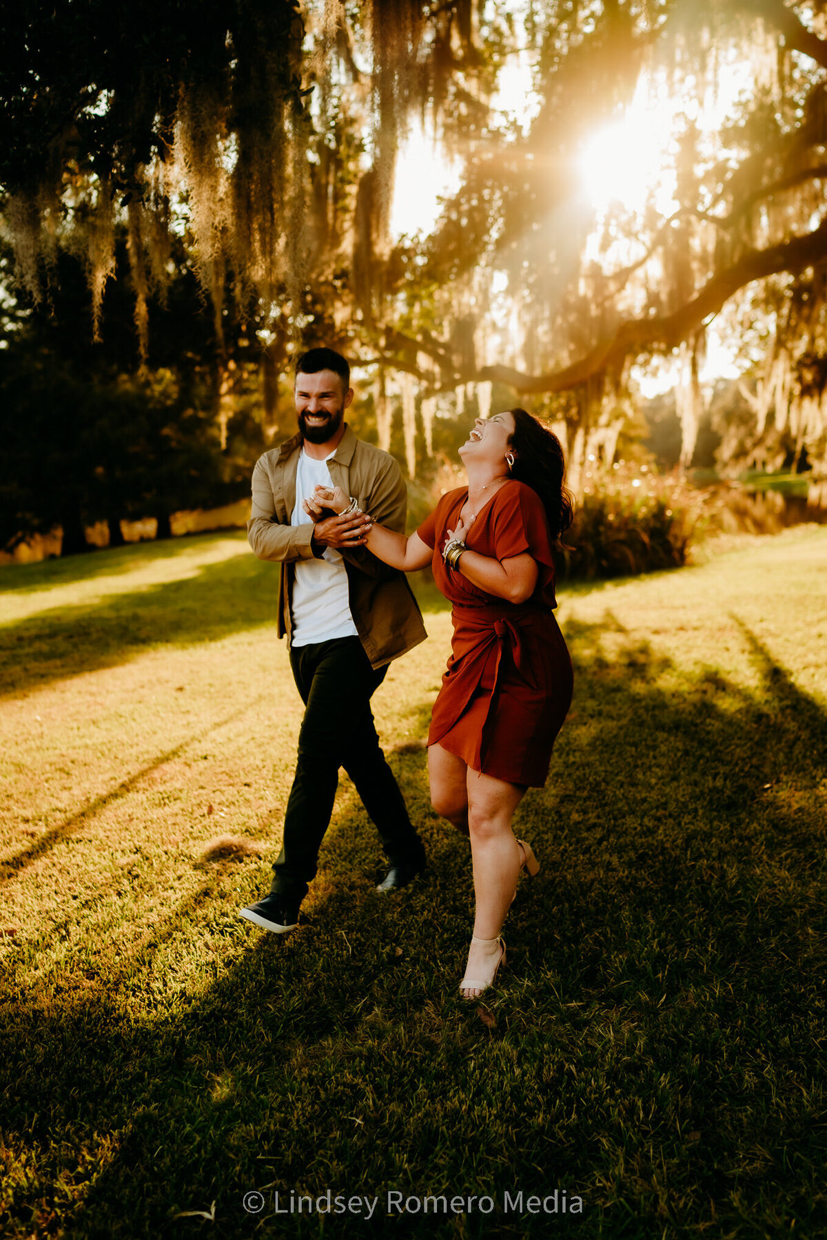 candid pose of couple laughing at avery island, new Iberia, la