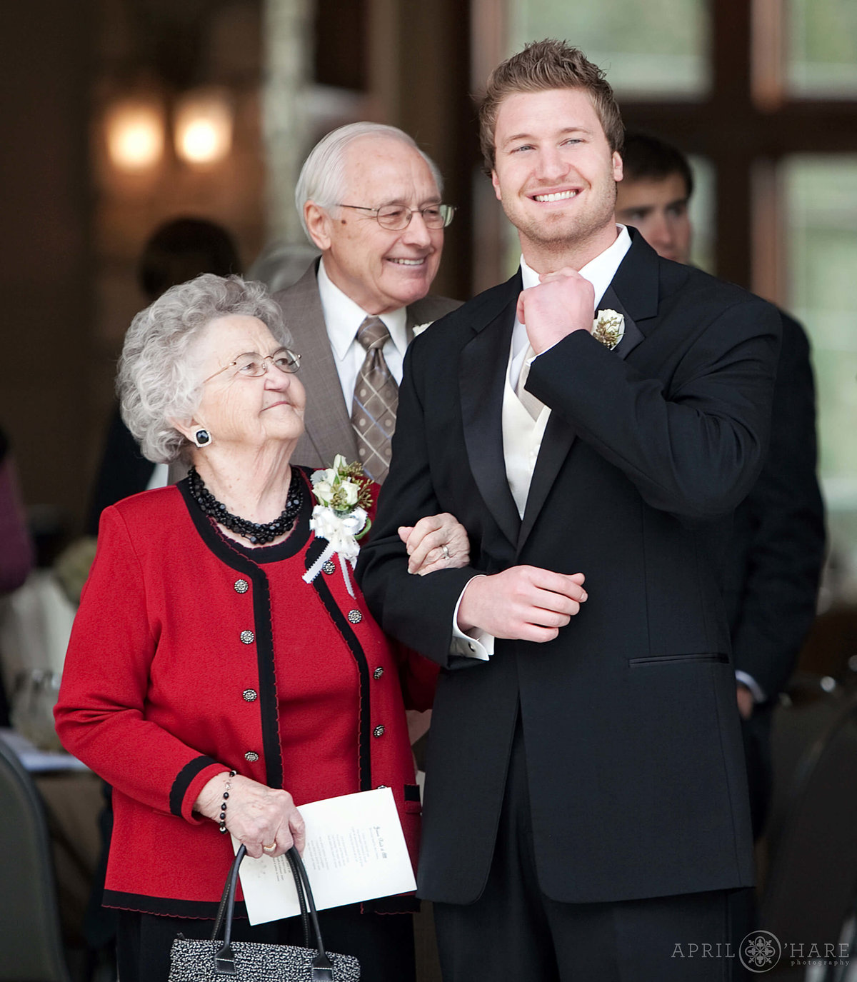 Sweet wedding photo of Grandma looking at her grandson at Cielo in Castle Pines in Colorado