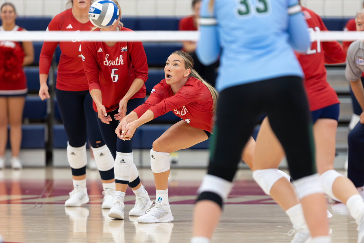 Hannah Maddux of The University of South Alabama digs a ball during a match with Tulane.