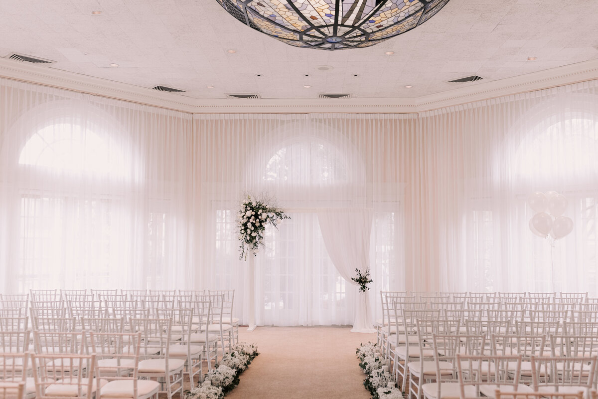 Soft light pours through the drapes in the Pavilion, illuminating the space before guests arrive for the wedding ceremony.