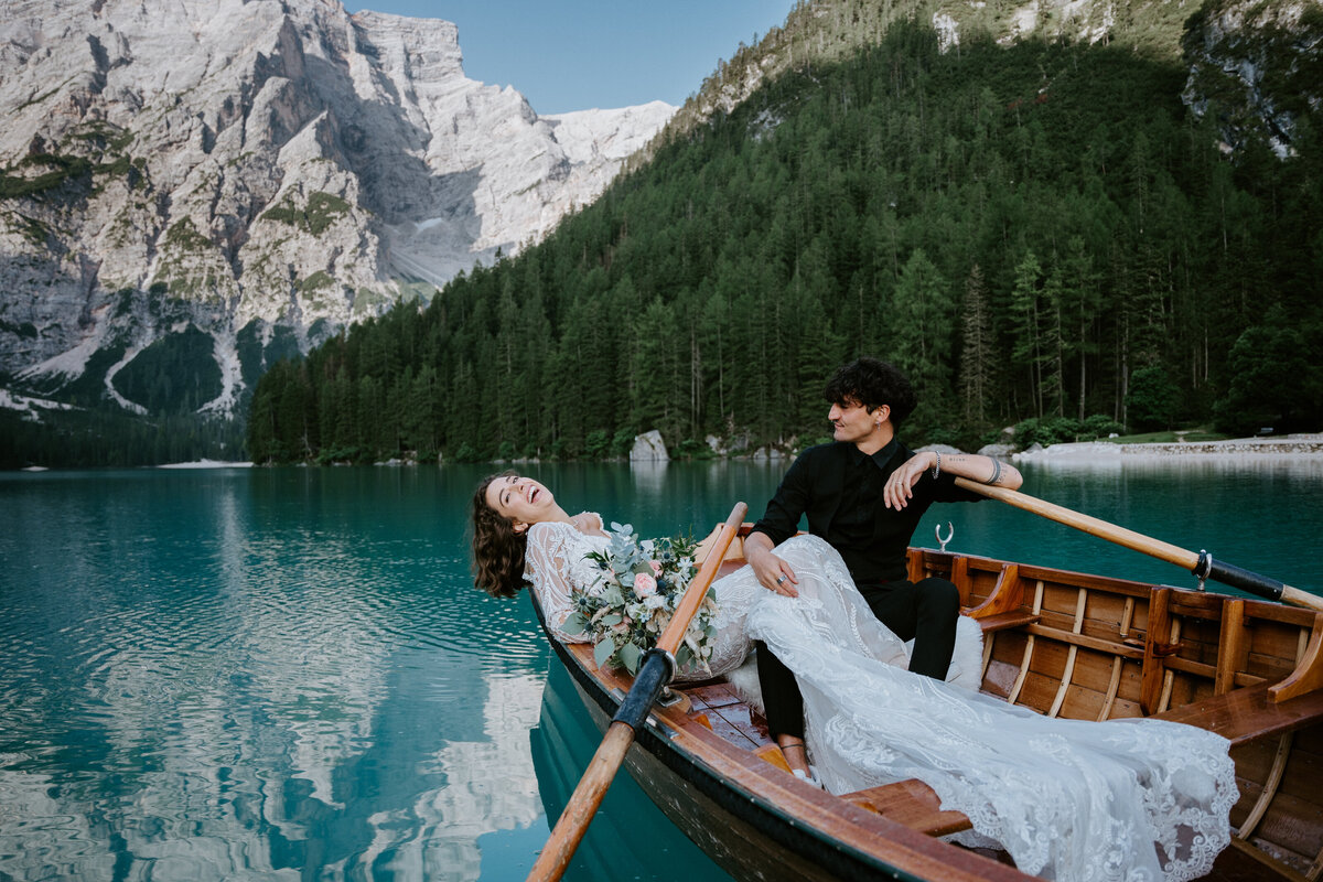 Couple eloping at Lago di Braies  at boathouse La Palafitta