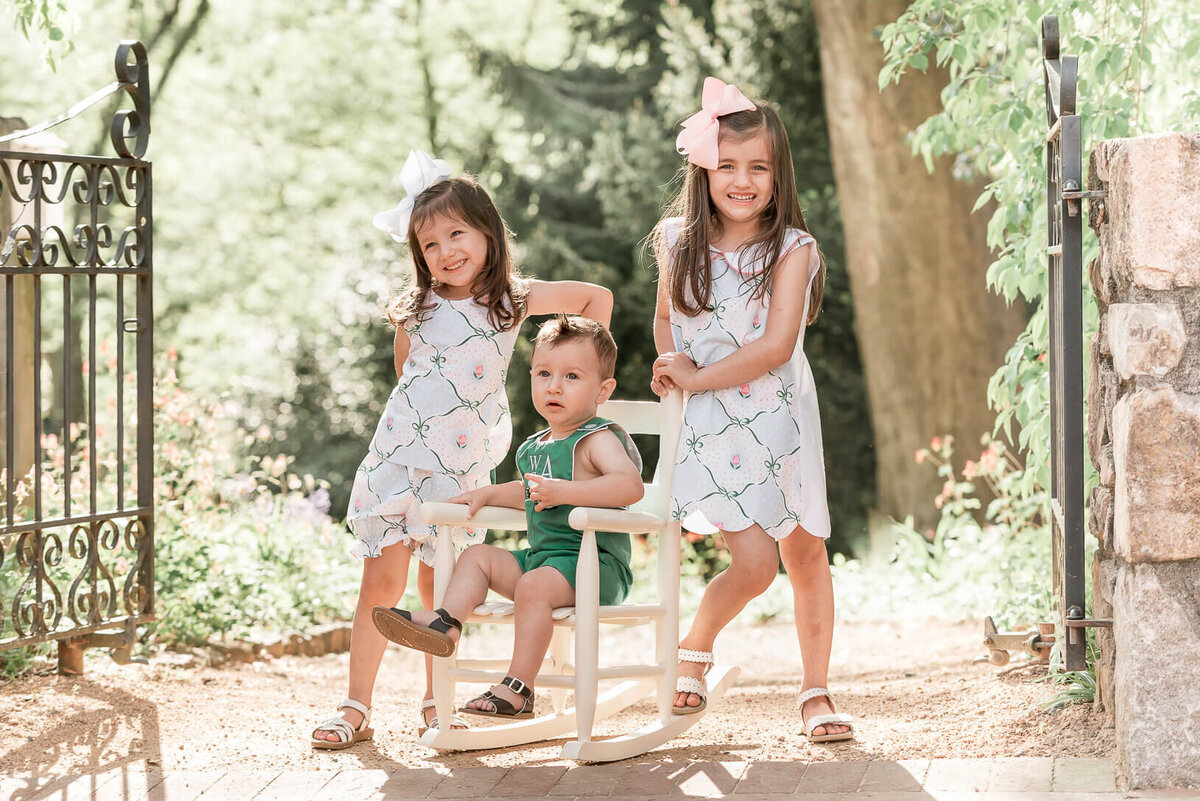 three kids at coker arboretum in chapel hill