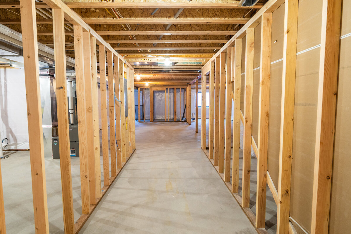 new-house-unfinished-basement-hallway