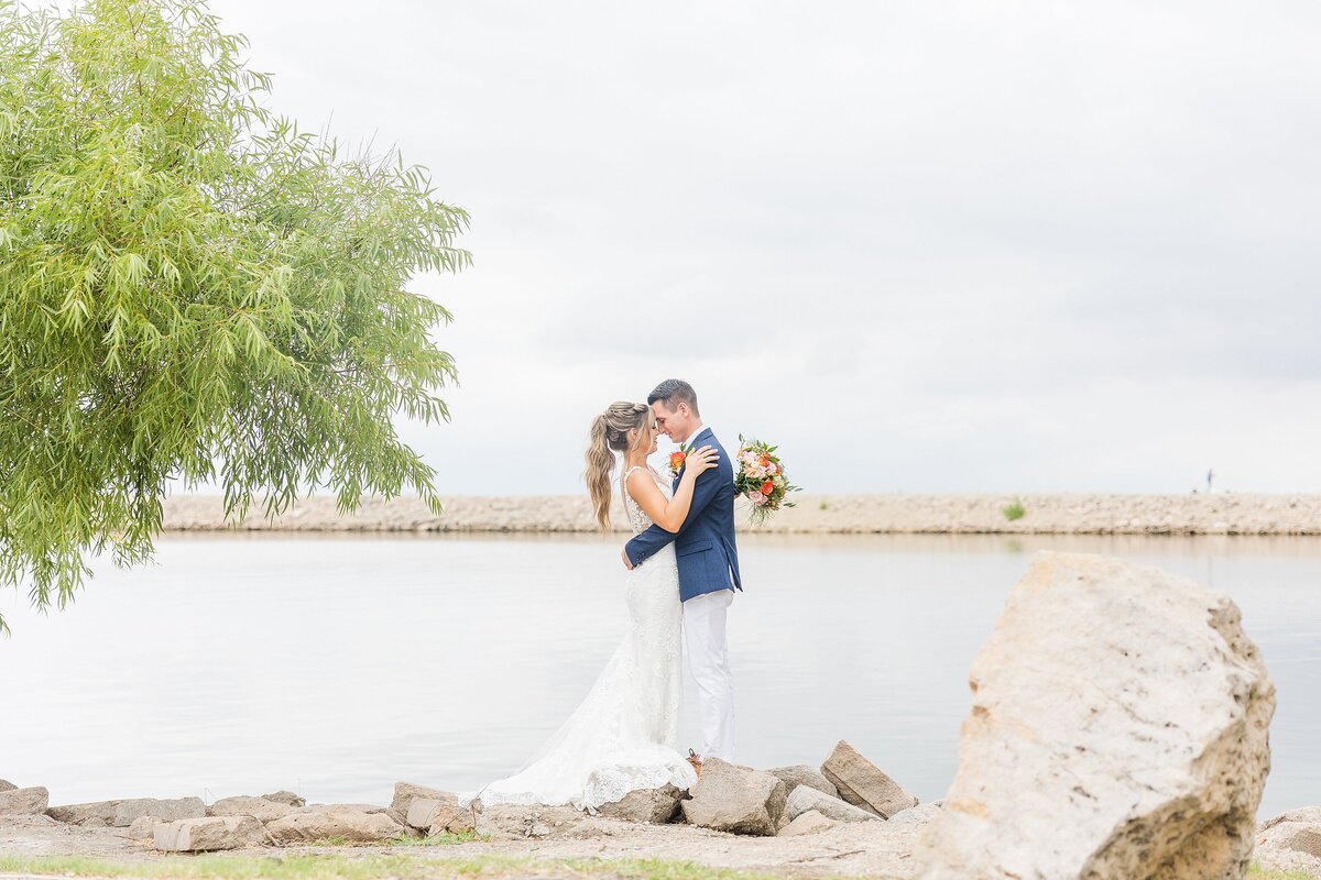Bride and groom near Cheney Lake in summer