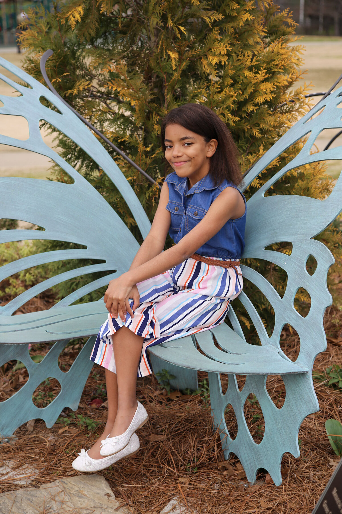 Lexi on butterfly bench