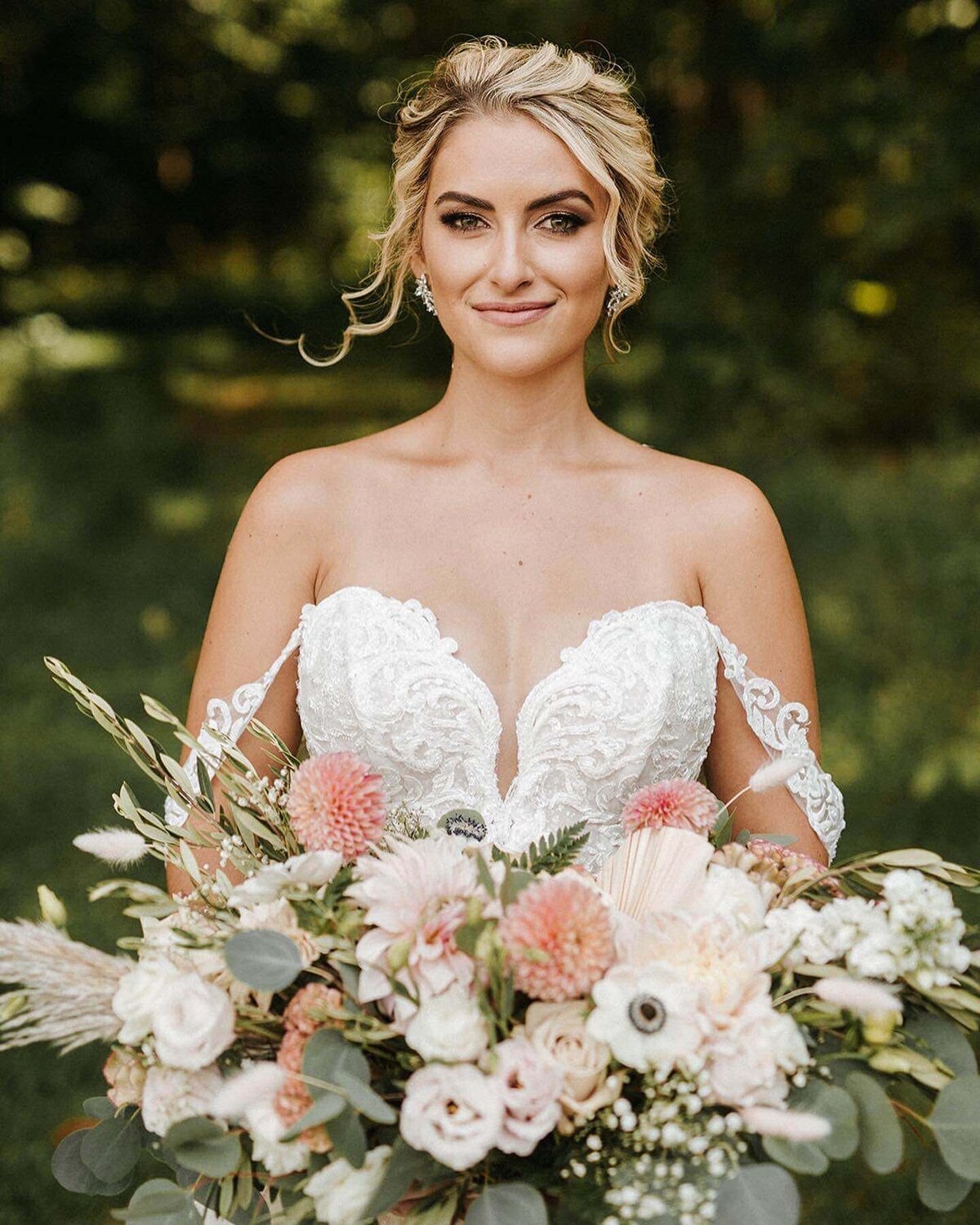 Natalie Brown wedding - bride holding flowers