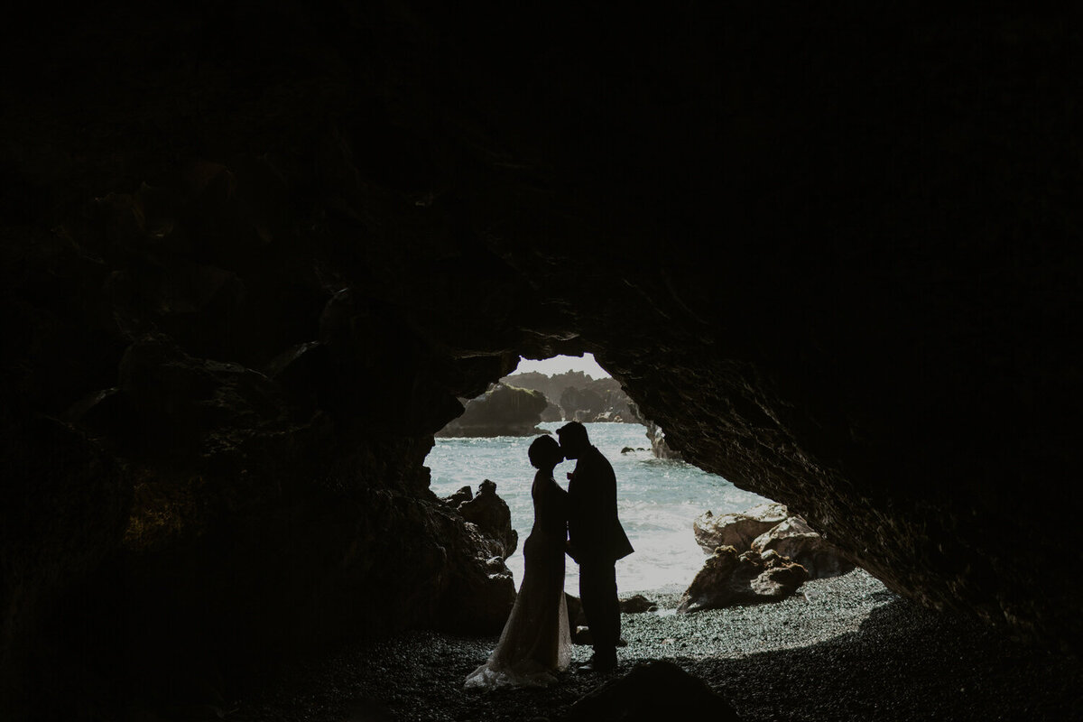 Maui Beach wedding couple kissing in cave