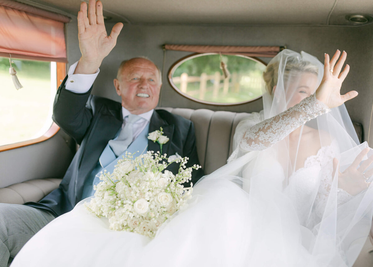 chloe-winstanley-weddings-father-bride-waving-rolls-royce
