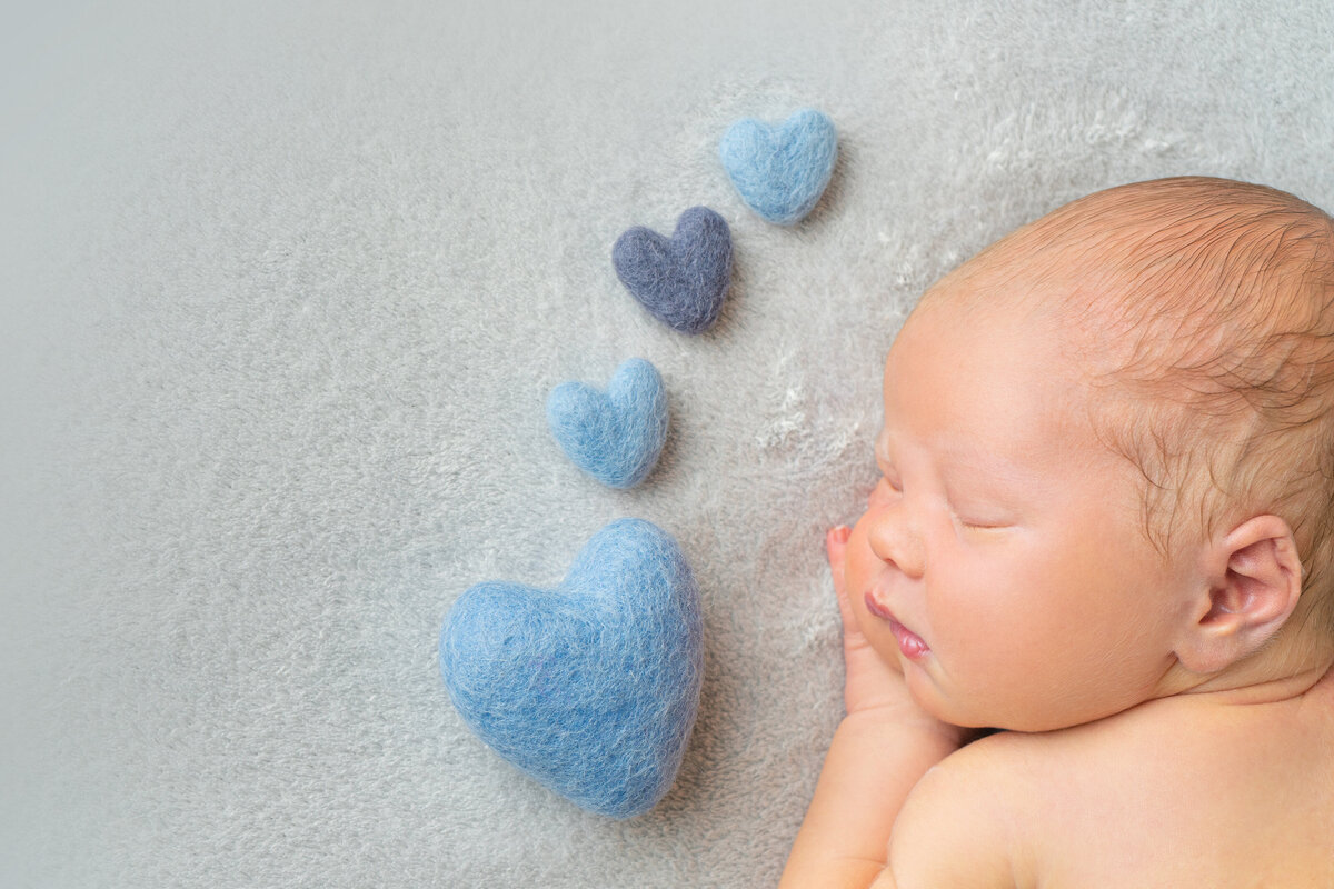newborn-baby-with-blue-hearts