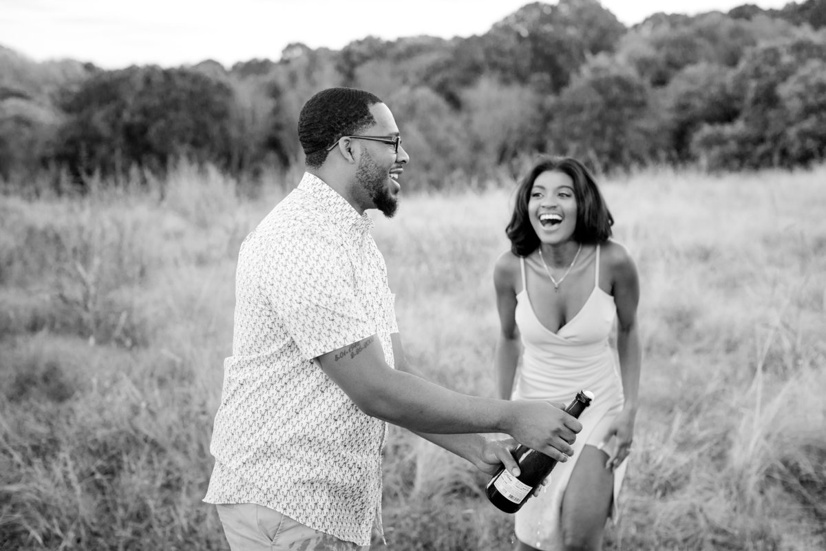 Popping bottles during an engagement session at NCMA in Raleigh