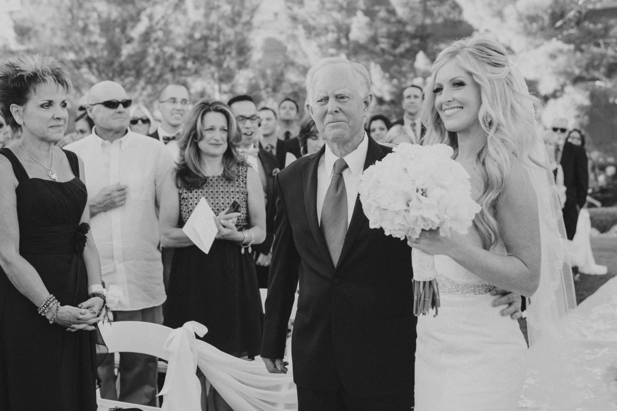 black and white photo of father giving away the bride | Susie Moreno Photography