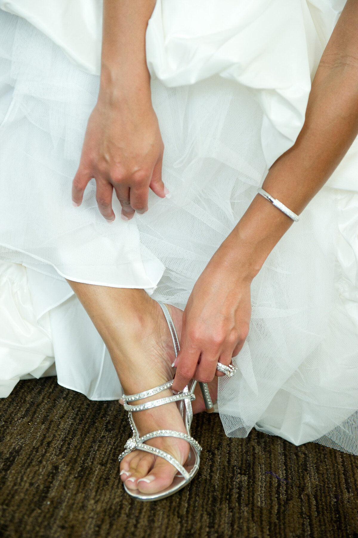 Bride wearing her wedding sandals