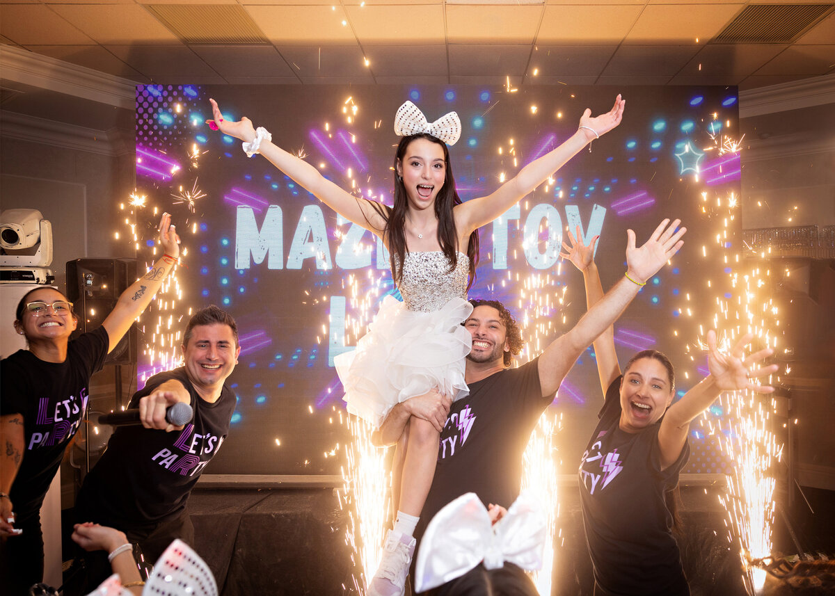 bat-mitzvah-girl-sitting-shoulders-sparks-wilshire-grand