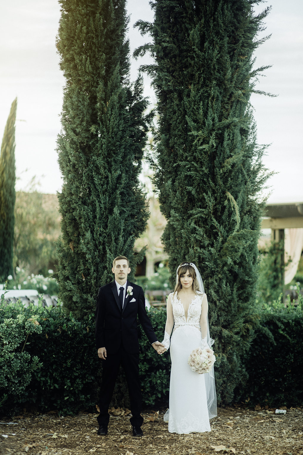 Wedding Photograph Of Bride And Groom Holding Hands In The Garden Los Angeles