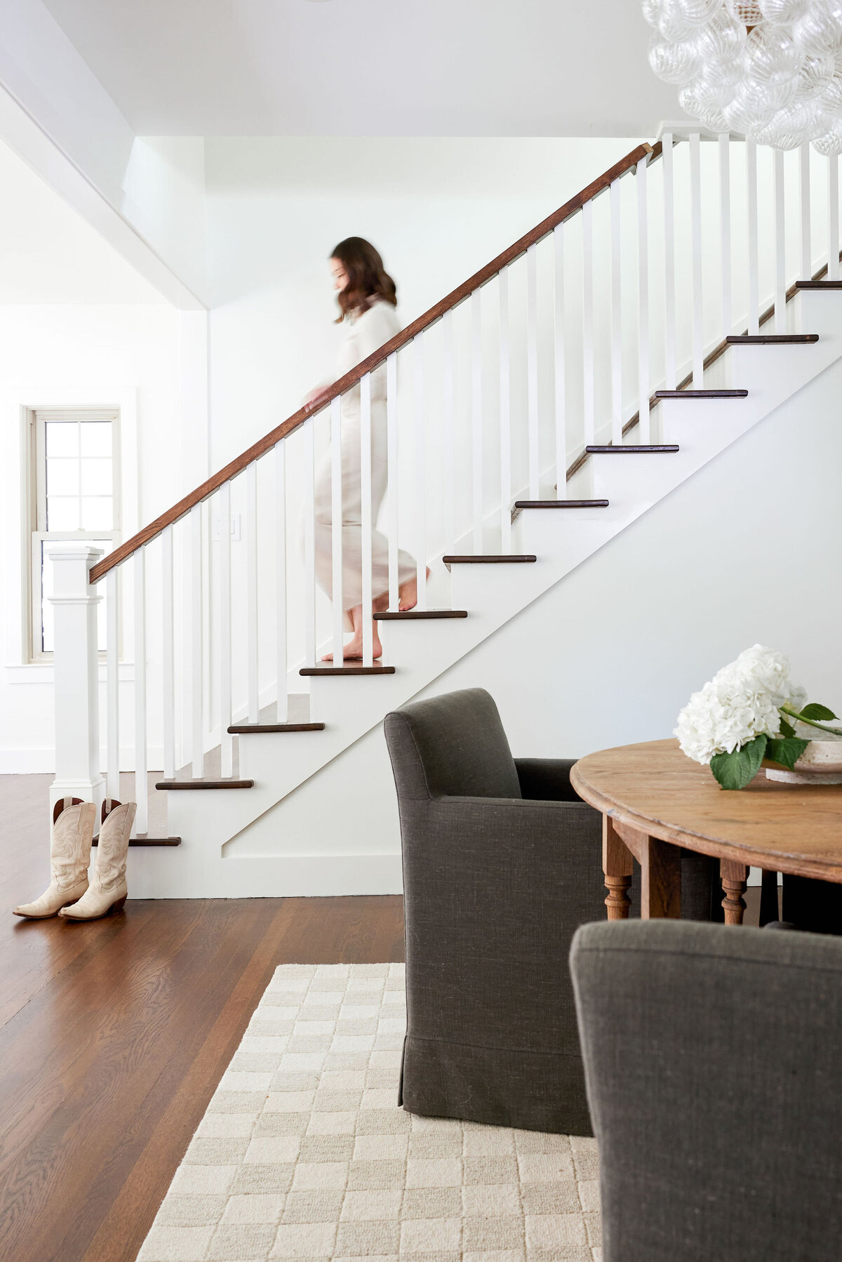 cocoloba homes cockrell ave women walking down the stairs with wooden handrail