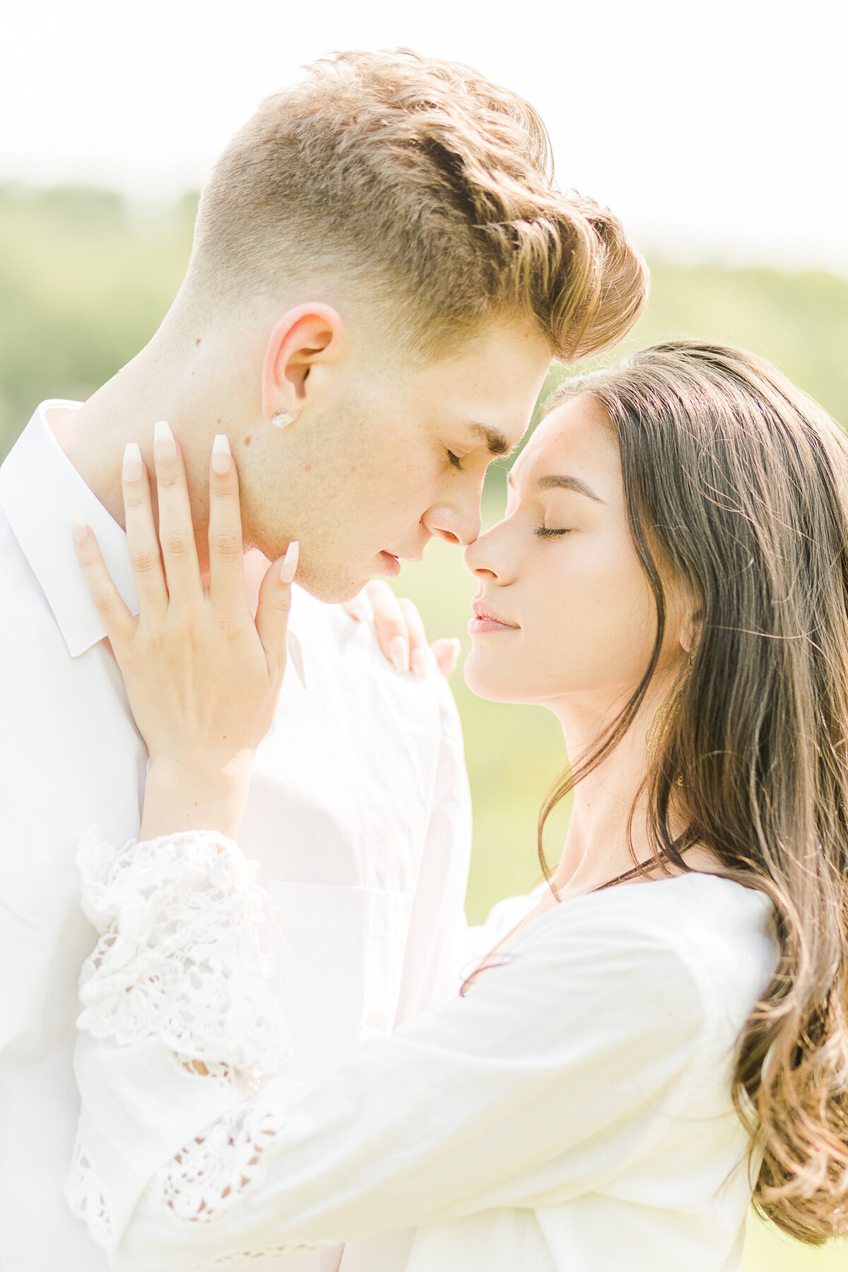 Close up image of a couple about to kiss at their Smolak Farms Engagement Photoshoot in New Andover, MA. Captured by New England Wedding Photographer Lia Rose Weddings.