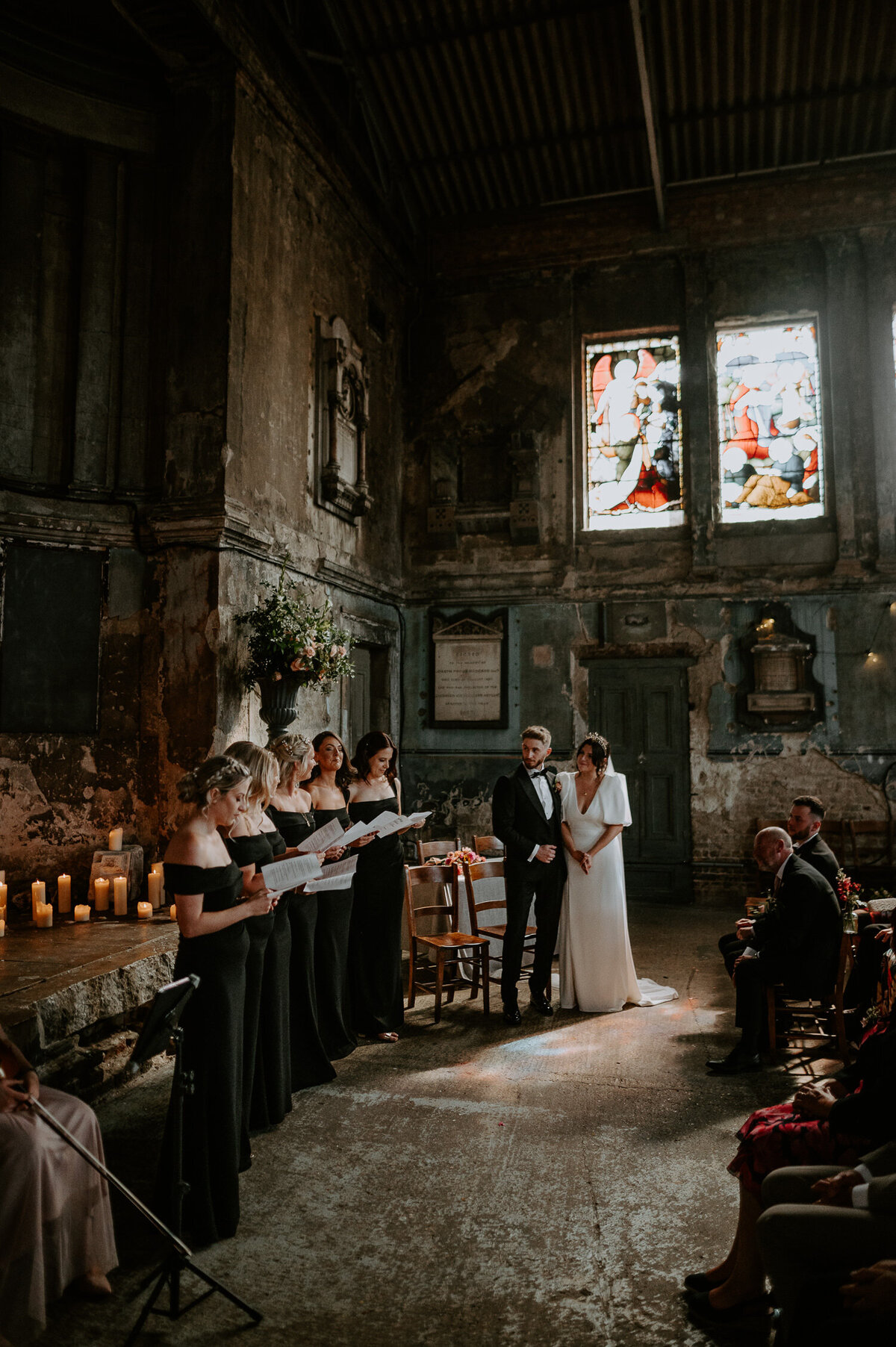 Bridesmaids read a poem during a ceremony at The Asylum Chapel in London.