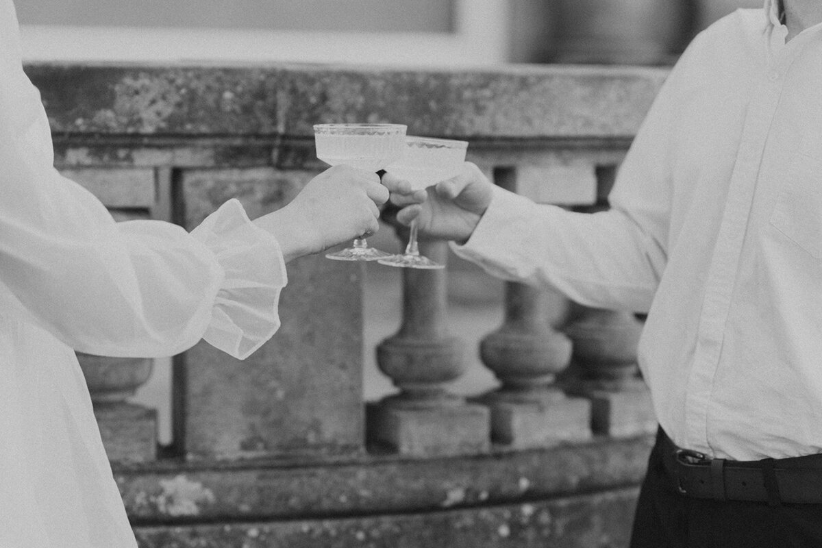 the-groom-and-the-bride-clink-their-glasses-with a- champagne