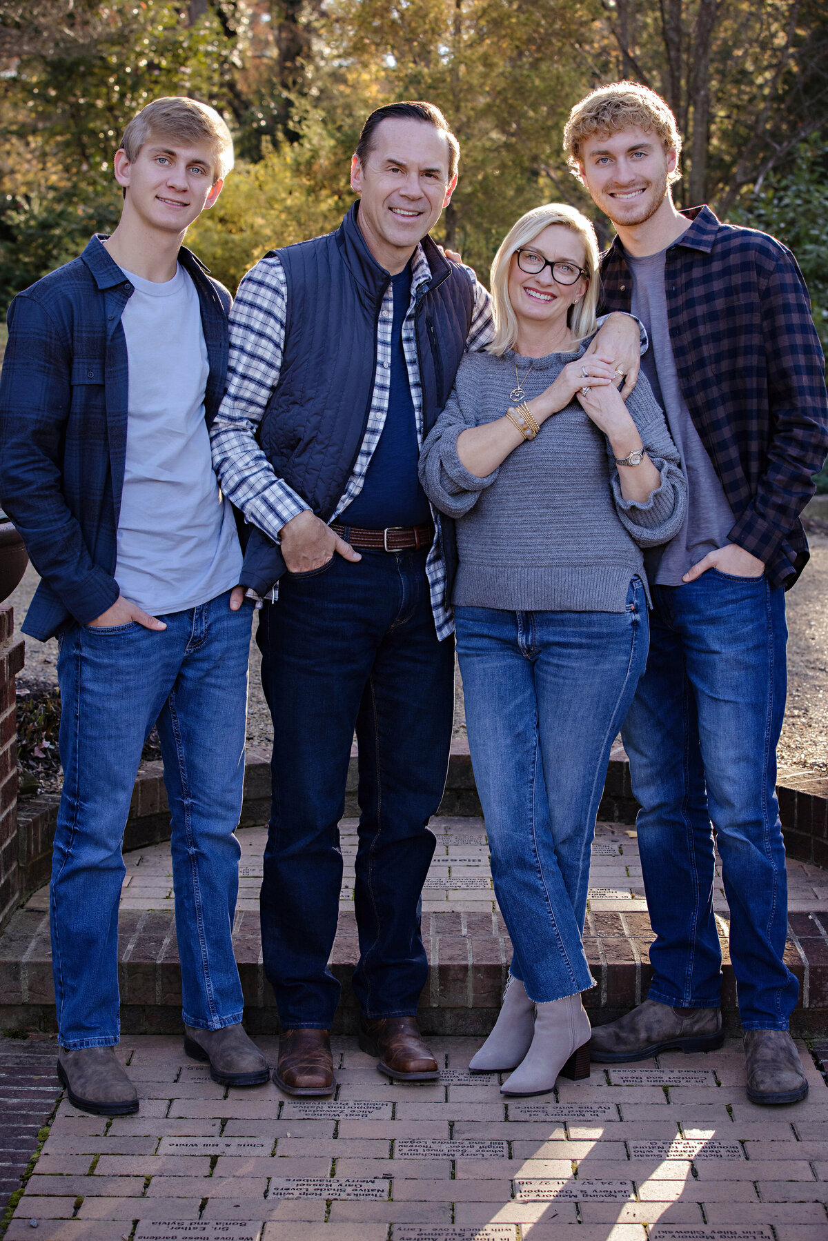 Brilliant autumn family photo framed by greenery at UNCC Botanical Garden Charlotte NC
