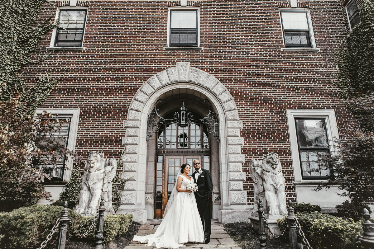 Bride and Groom standing in front of building in Buffalo, New York
