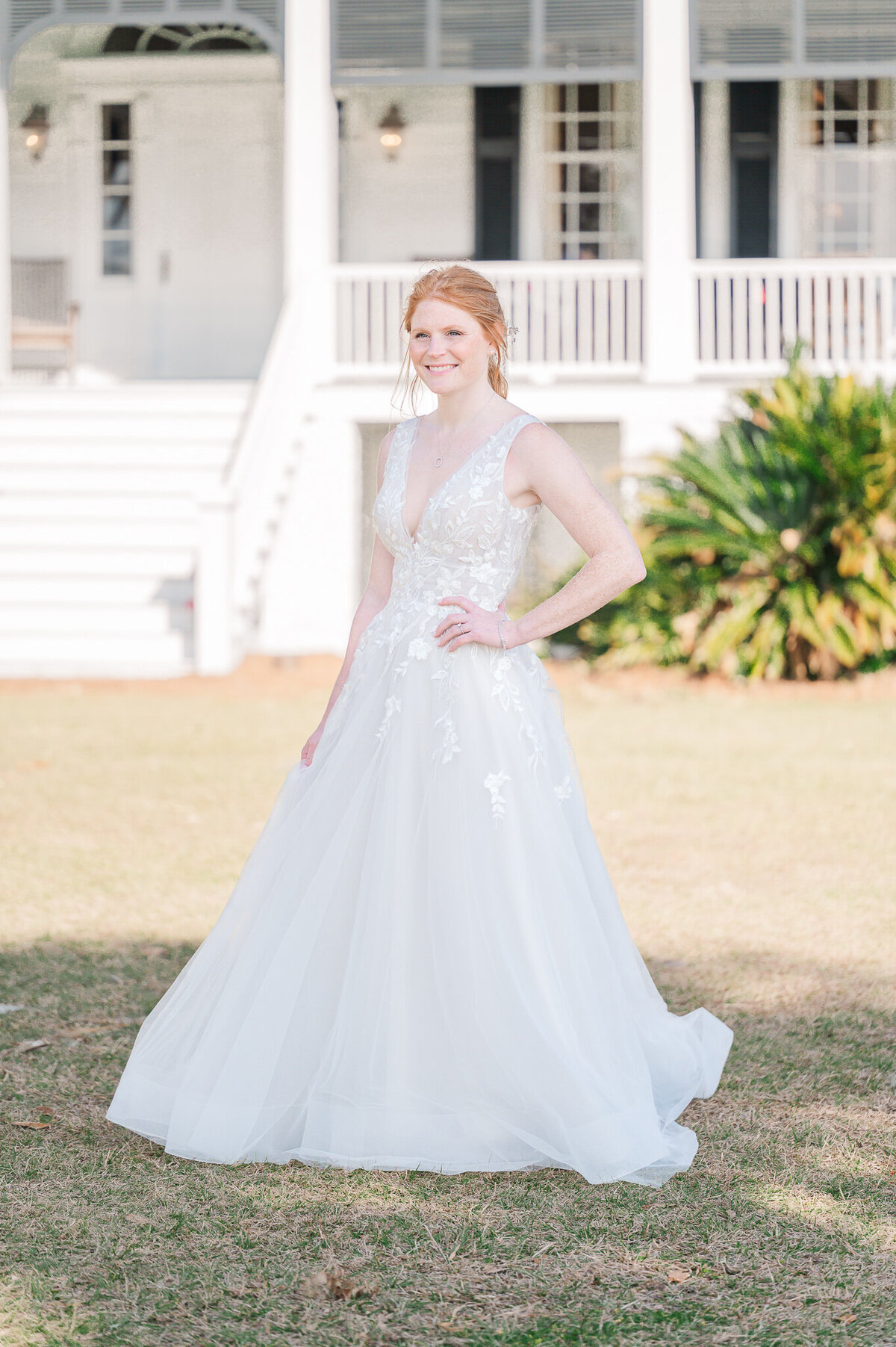 A beautiful redheaded bride enjoying her North Carolina wedding photography bridal portraits