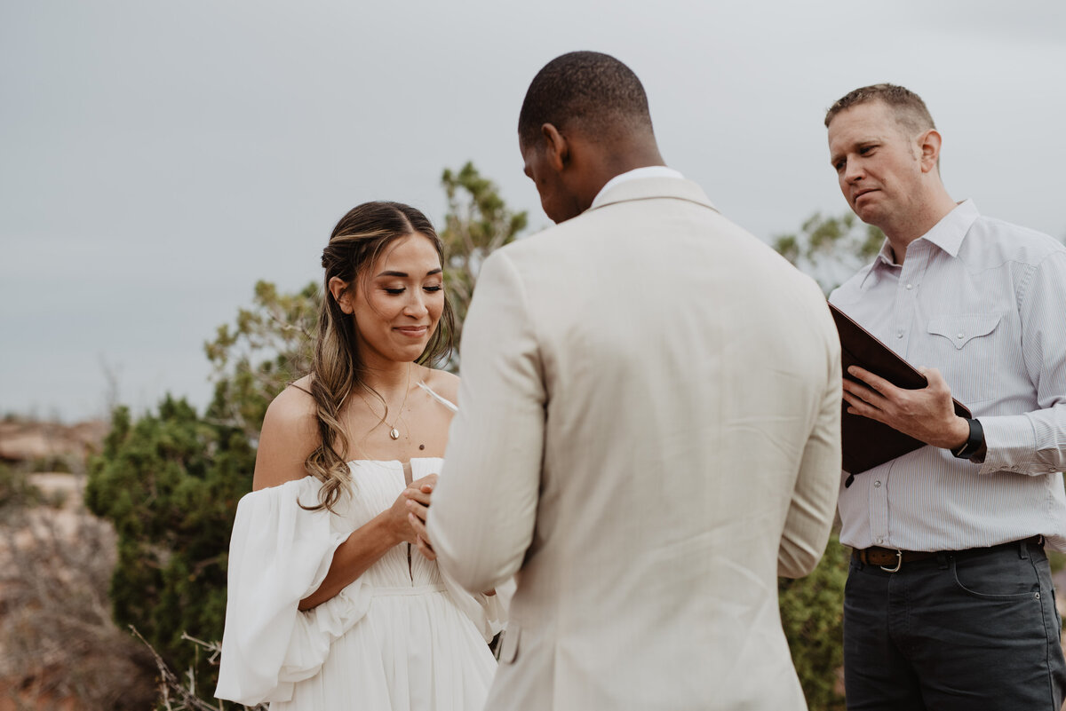 Utah Elopement Photographer captures bride putting ring on groom