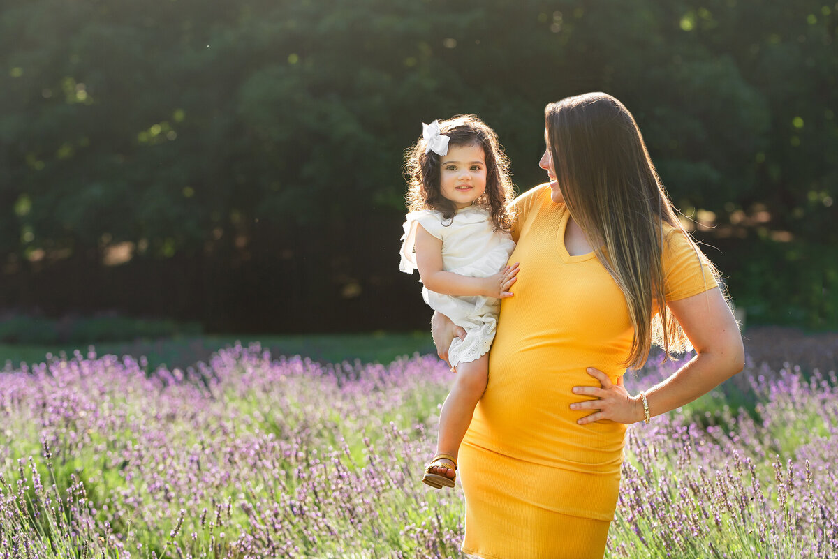 Hoboken Maternity Photographer, lavender fields pictures, bloom season pictures, family pictures, mother daughter, big sister, little sister, sisters, almost a sister, maternity shoot, lifestyle shoot, family photography, Hoboken, NJ. NYC, New Jersey, New York City, Jersey City, Jersey Shore