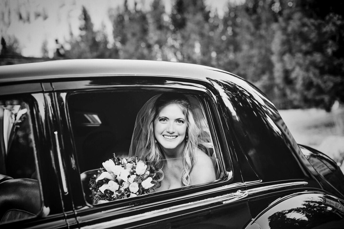 bride in vintage bentley black and white film image