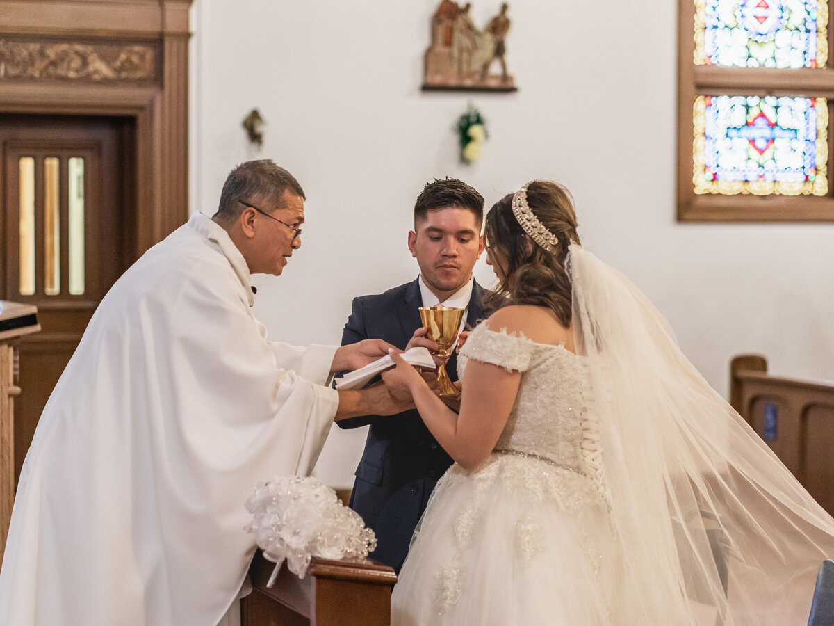 Traditional moment during the ceremony in a Hispanic wedding in a church in SF