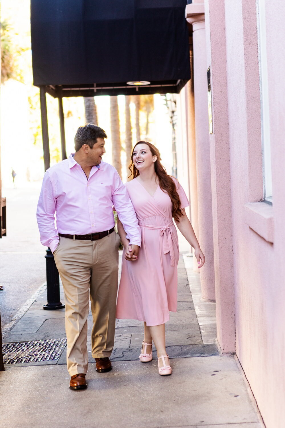 Bride and groom walk by The Mills House downtown, Charleston Wedding Photographer