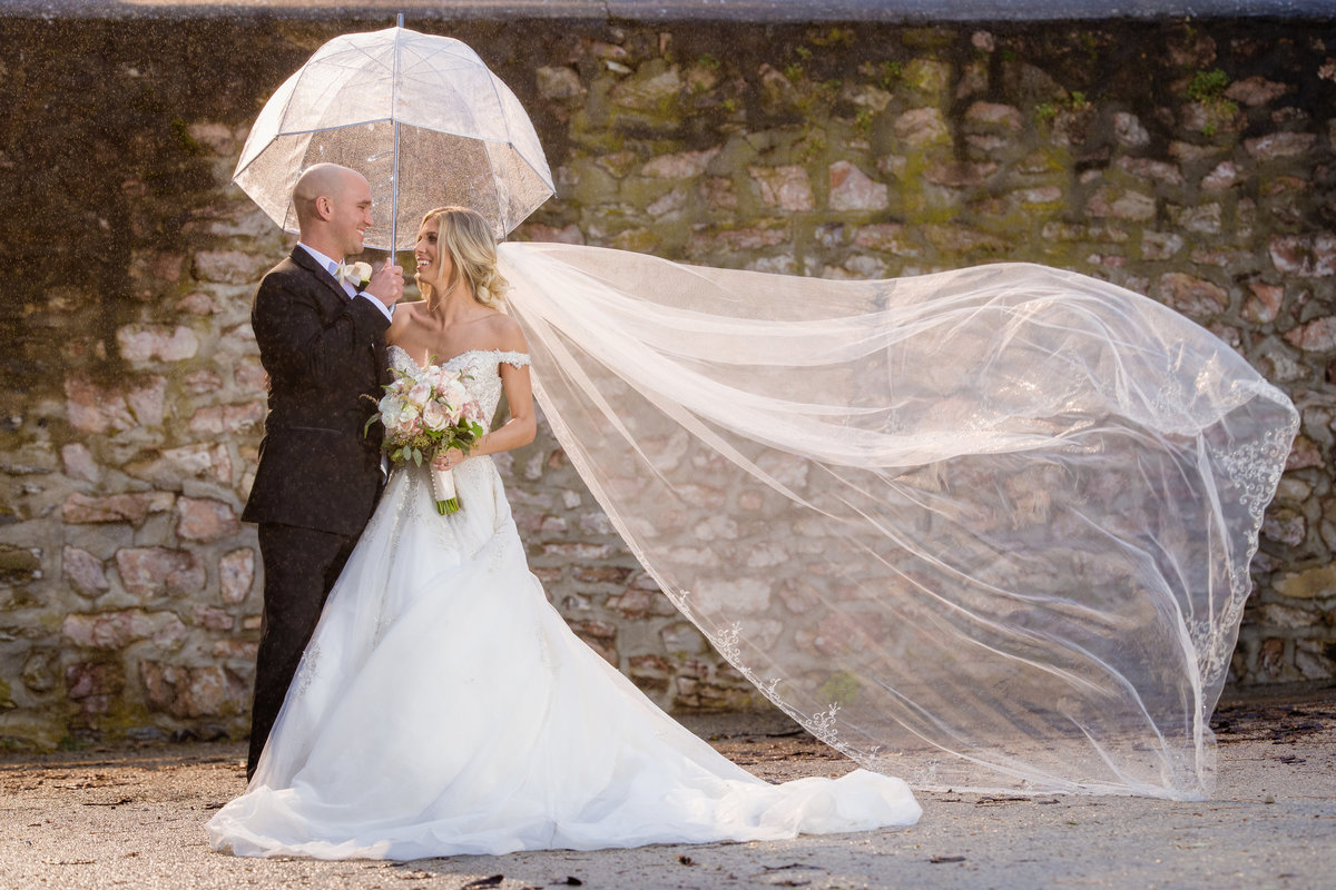 Bride and Groom in a sun shower