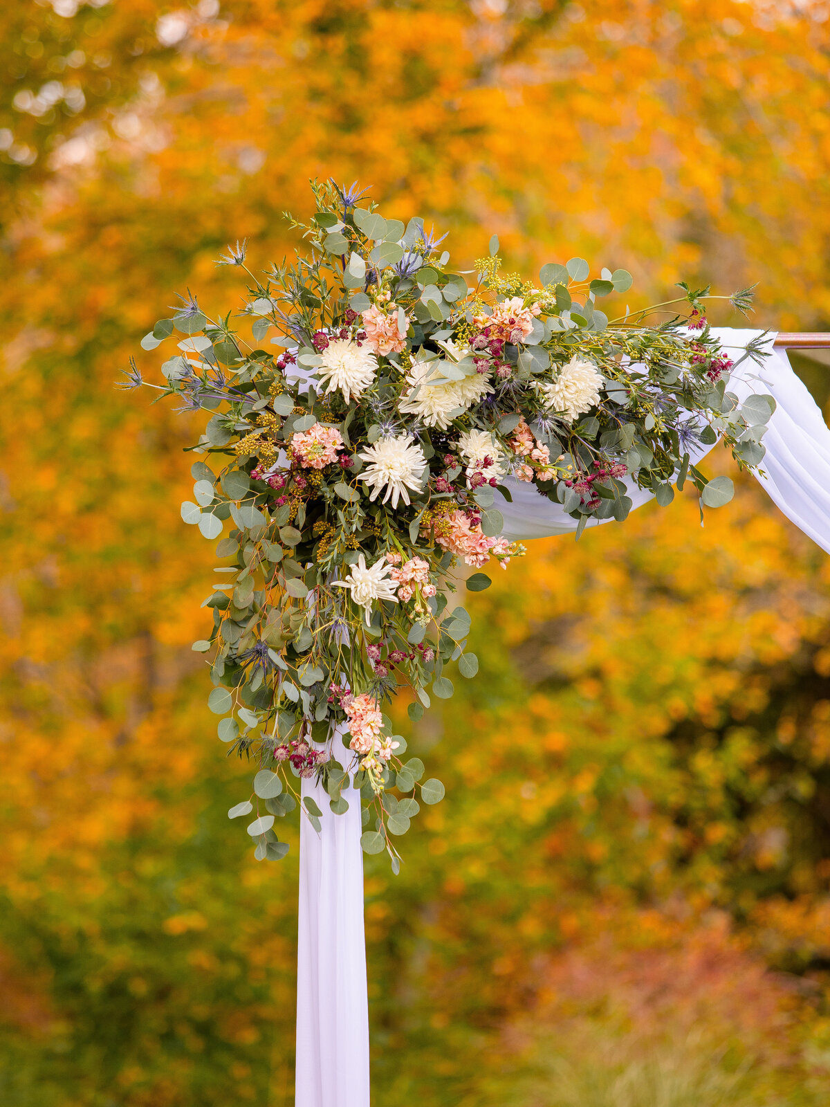 Fall wedding floral wedding ceremony arch.