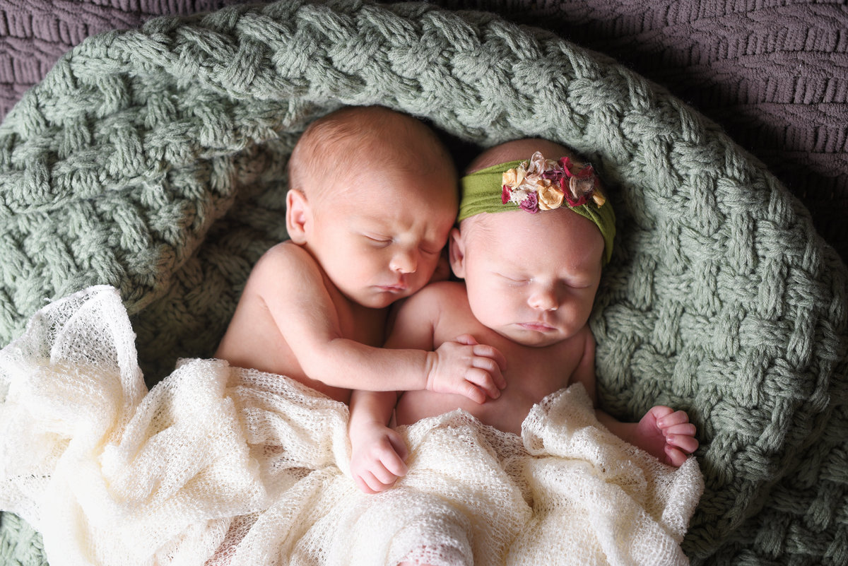 Beautiful Mississippi Newborn Photography: newborn boy and girl twins snuggling in a basket