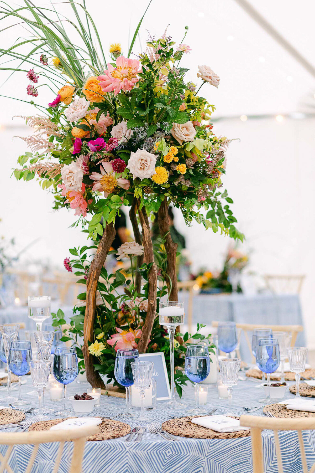 A private tented  beach wedding colorful table decor