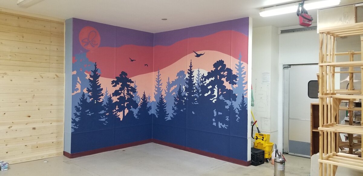 Custom mural on wall of sky and tree silhouettes
