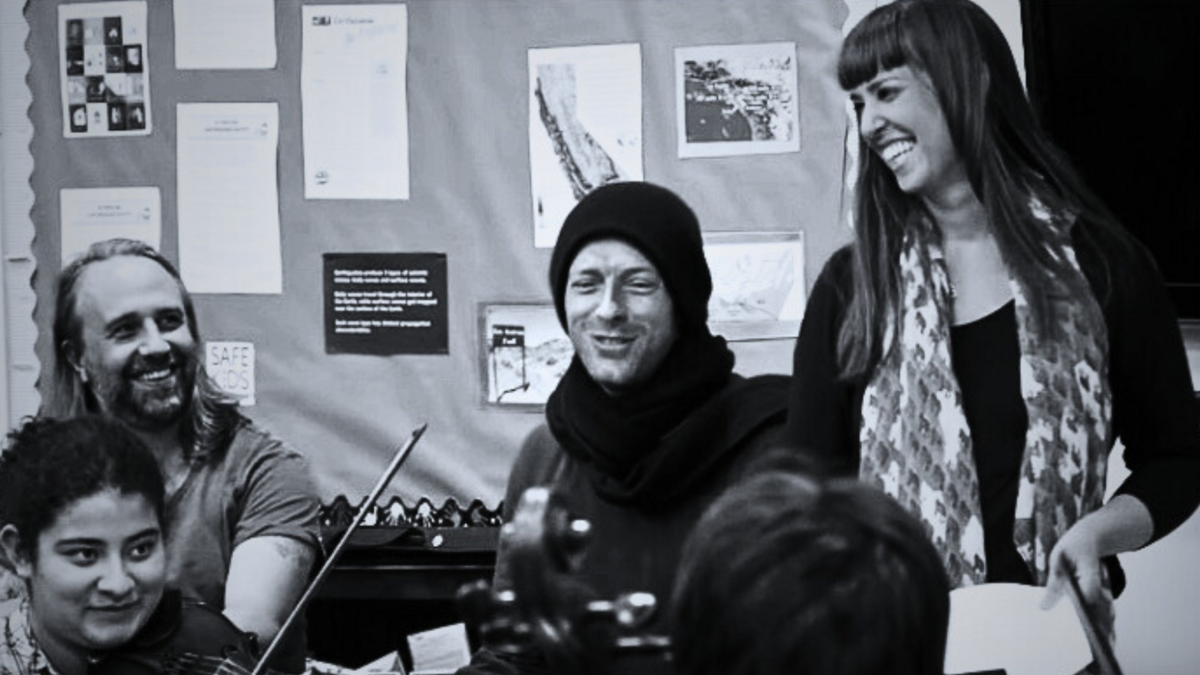 Ameena Maria Khawaja coaching YOLA with Chris Martin and Coldplay