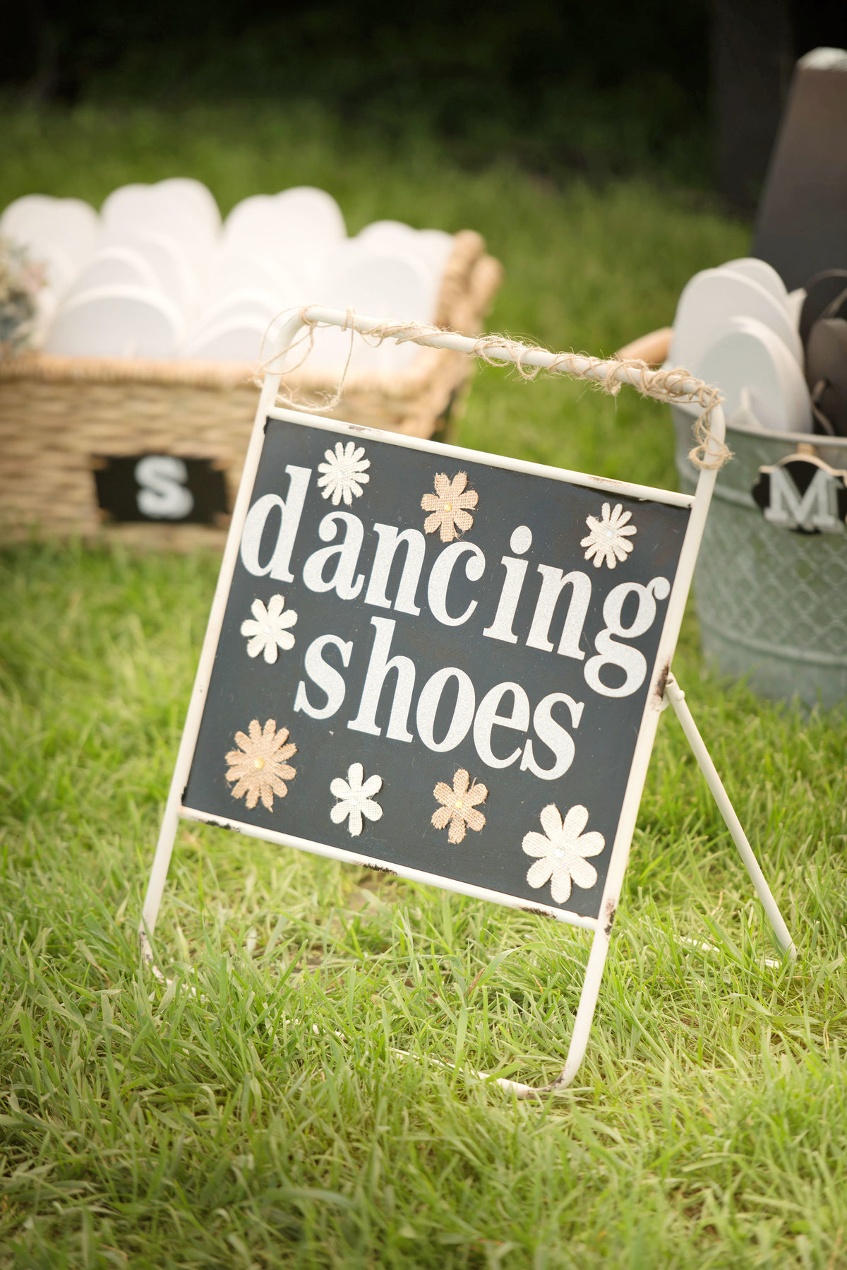 Dancing shoes sign at a tented wedding