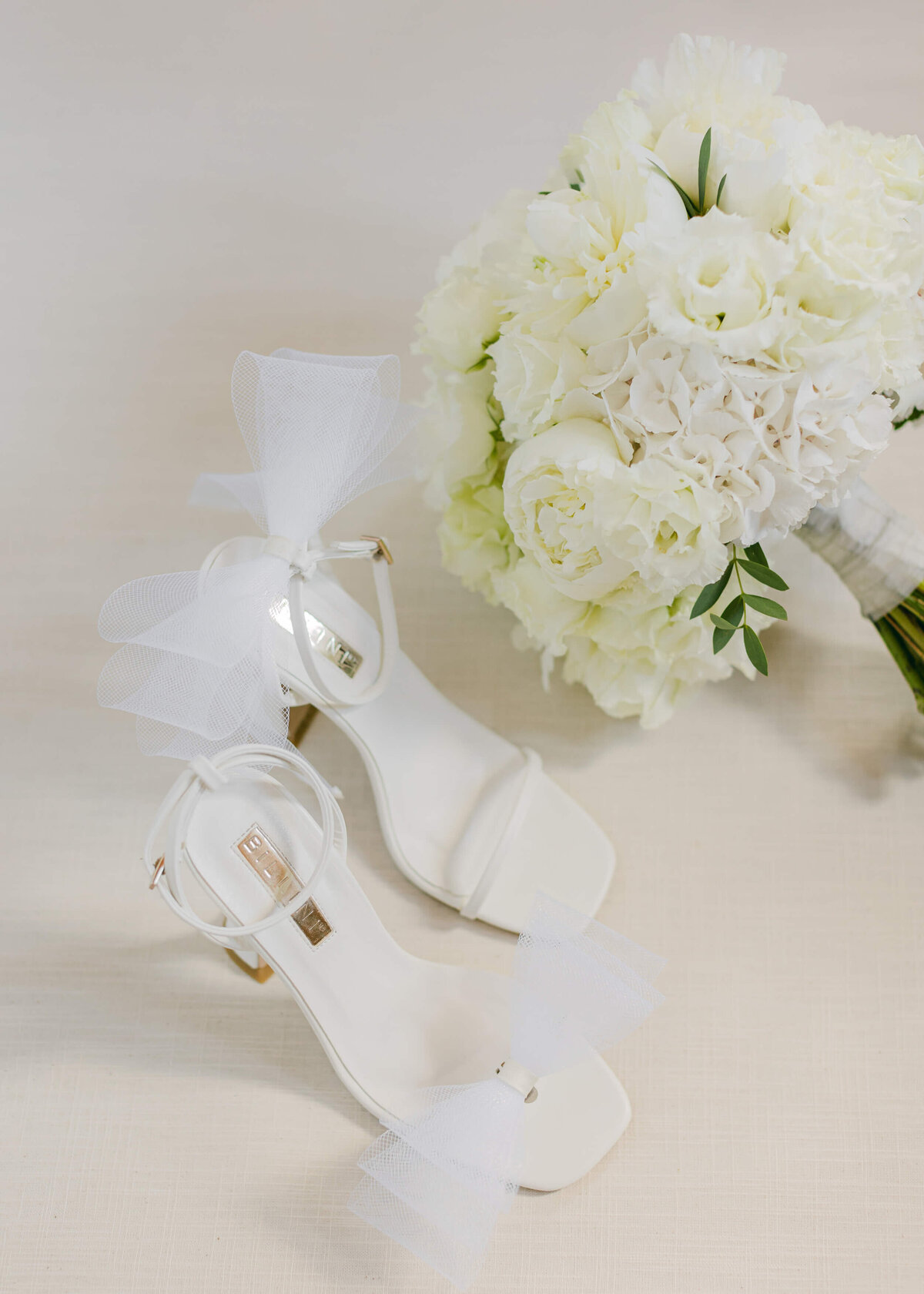 chloe-winstanley-weddings-white-bow-briadal-heels-boquet