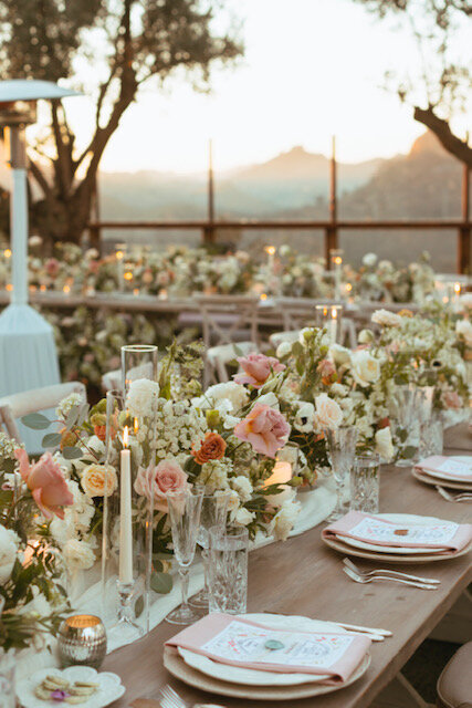 florals and candles on reception tables